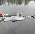 Порговый нфтесборщик ПН-3 на воде в цепи боновых заграждений